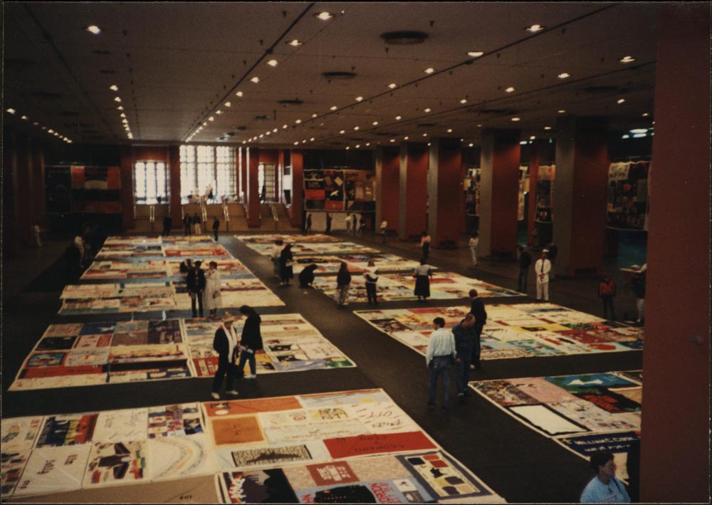 A table full of AIDS Memorial Quilts