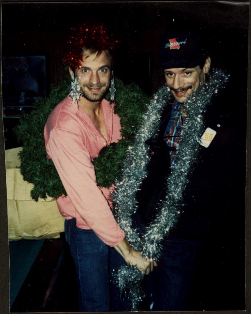Buddy Tayolr with ear rings, and a friend with a boa